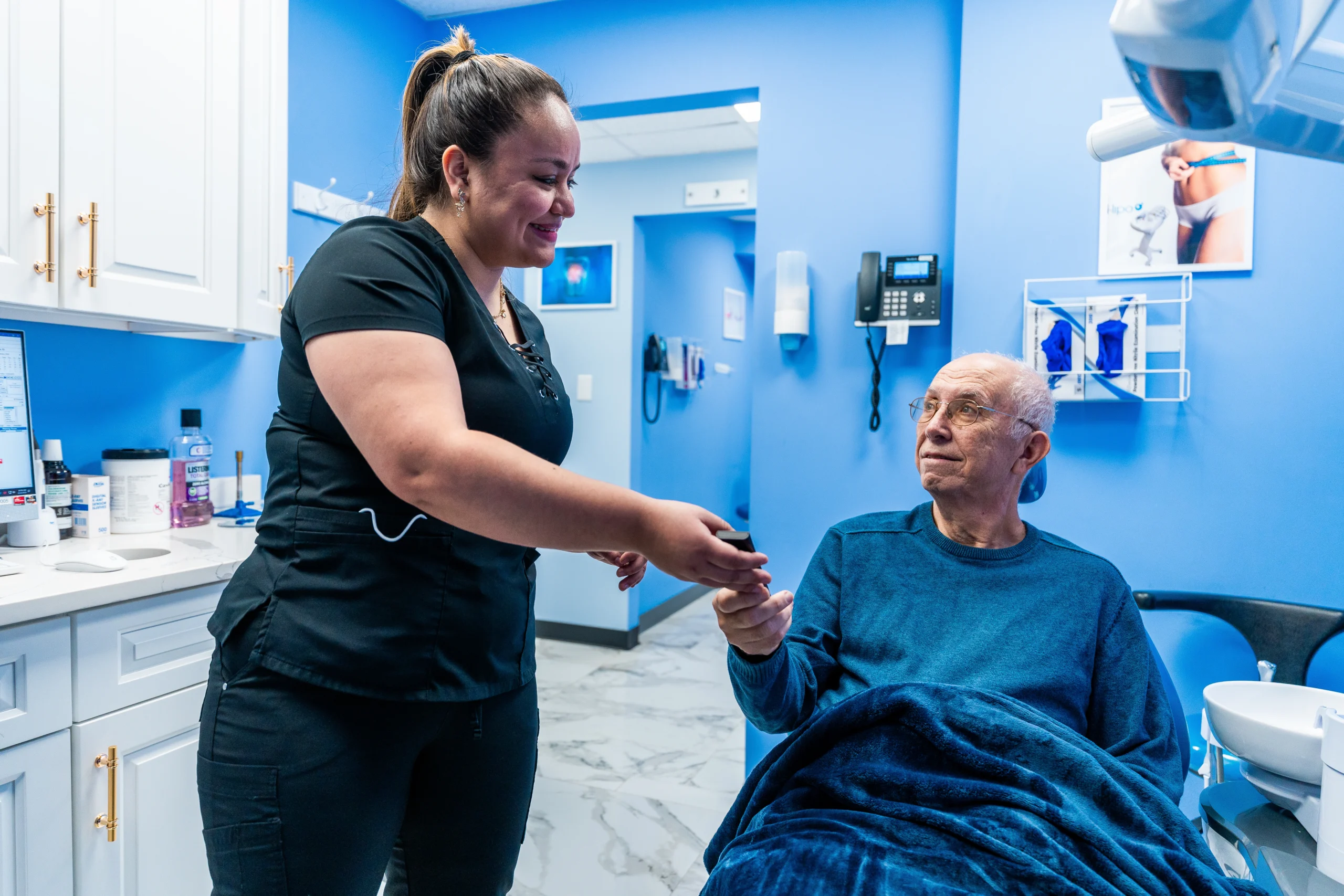 doctor at aura dental in new york and patients for general checkup